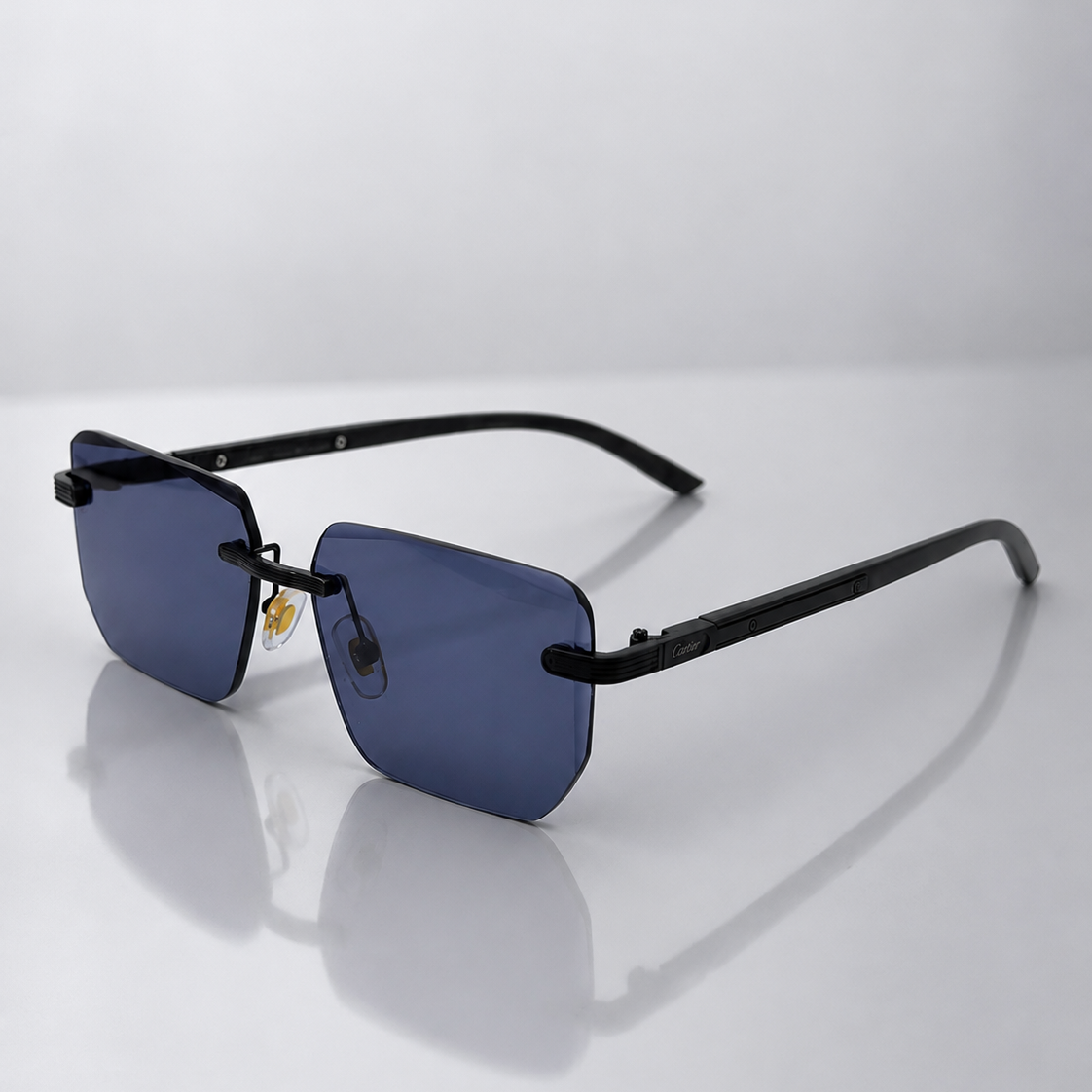 Cartier Rimless Sunglasses – 3/4 angle view, black frame blue lens