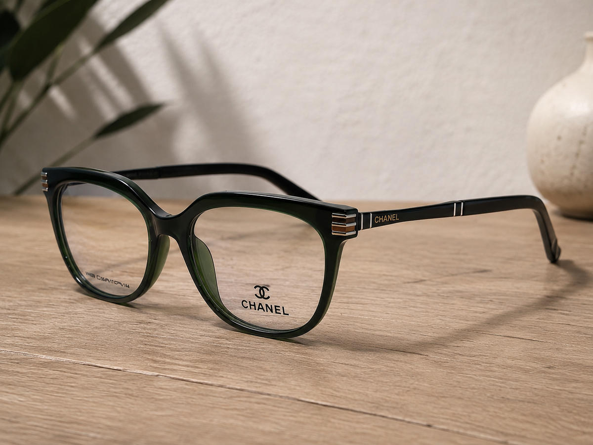Chanel Cat-Eye Eyeglasses Deep Green Silver - Side Angle Wood Table Lifestyle