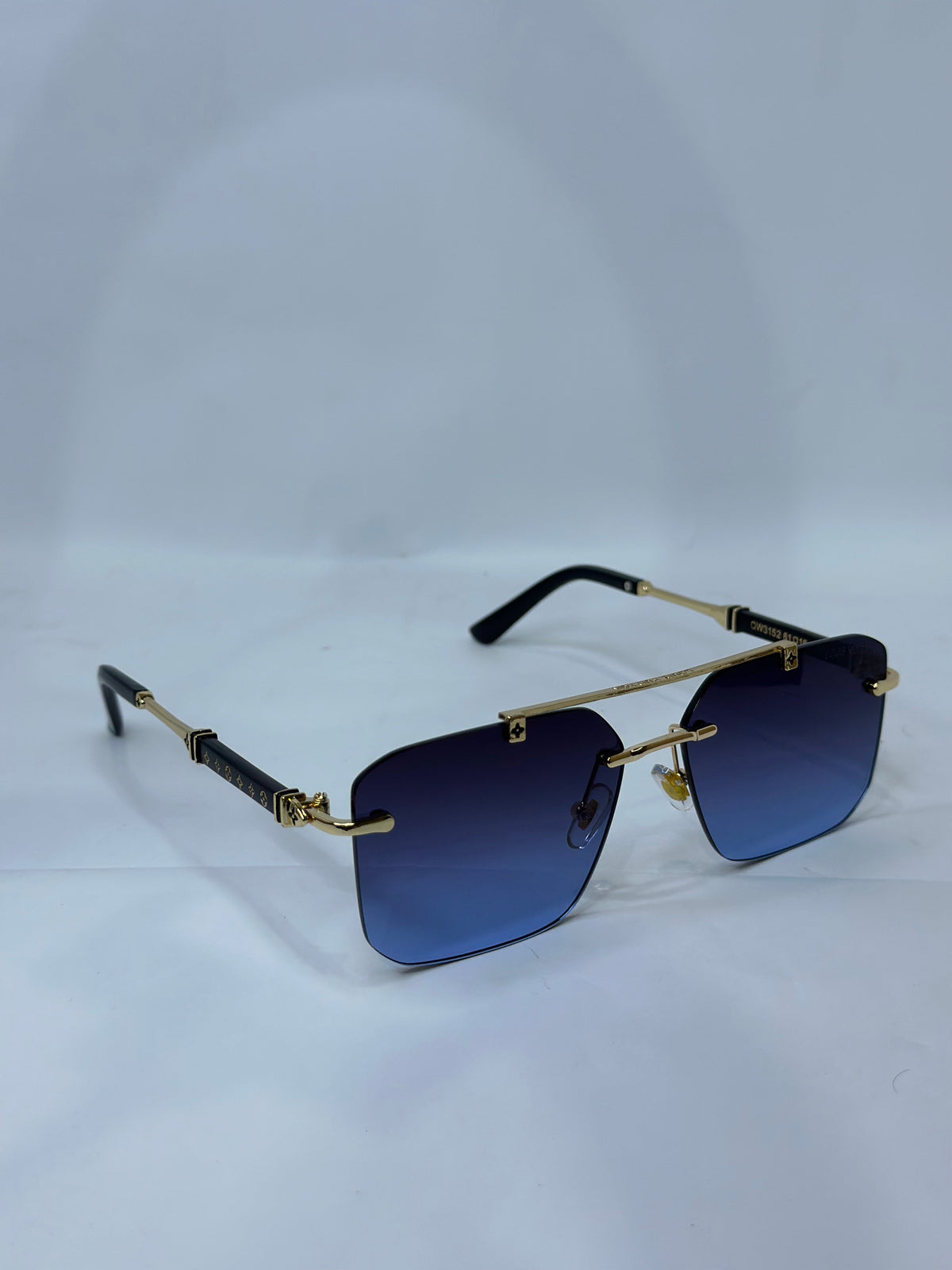 Louis Vuitton Rimless Square Sunglasses Blue Gradient Gold - White Background Overhead Angle